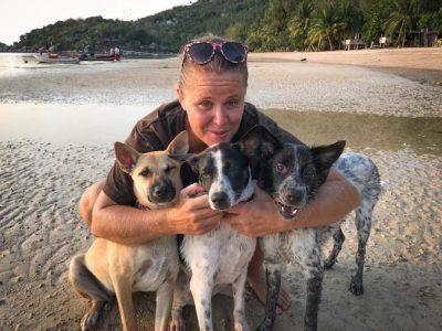 Lara from Koh Koh Pups with three dogs on Sairee Beach